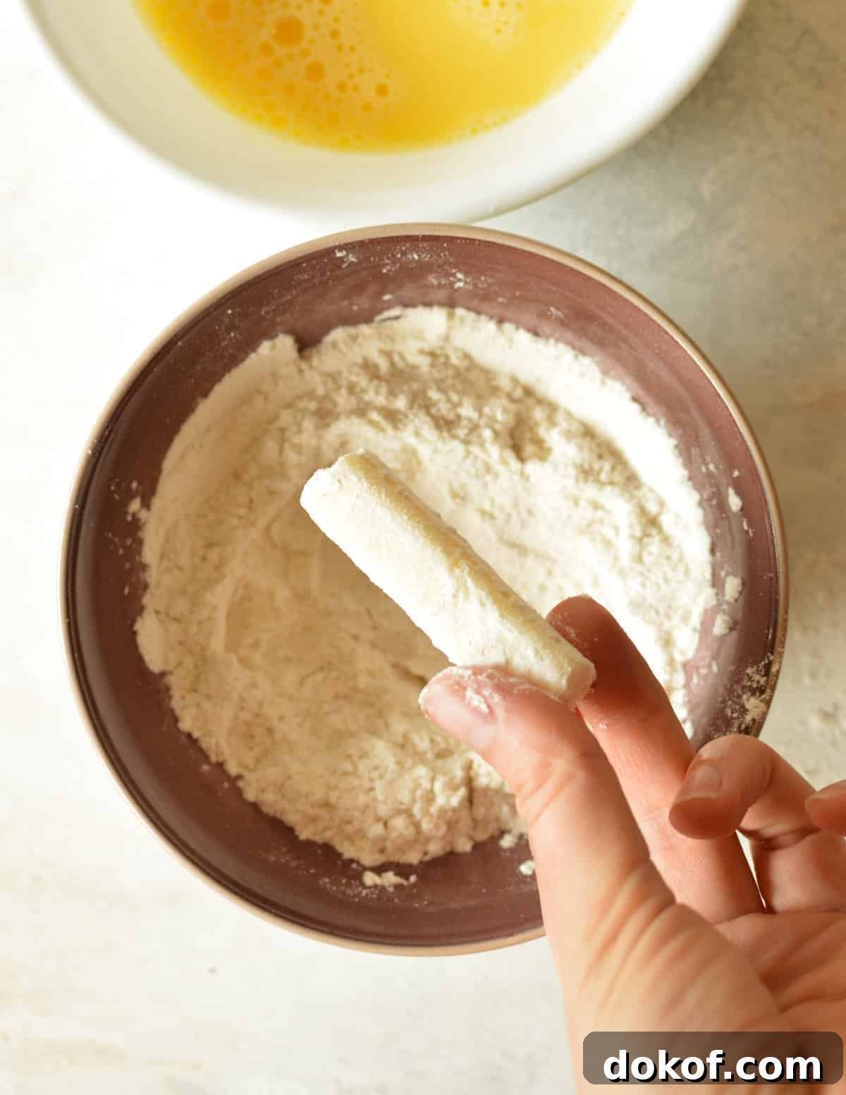 a cheese stick covered in gluten free flour