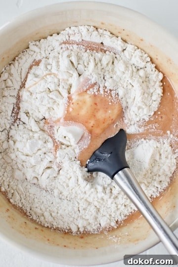 Folding in the flour to the ruby chocolate brownie batter.