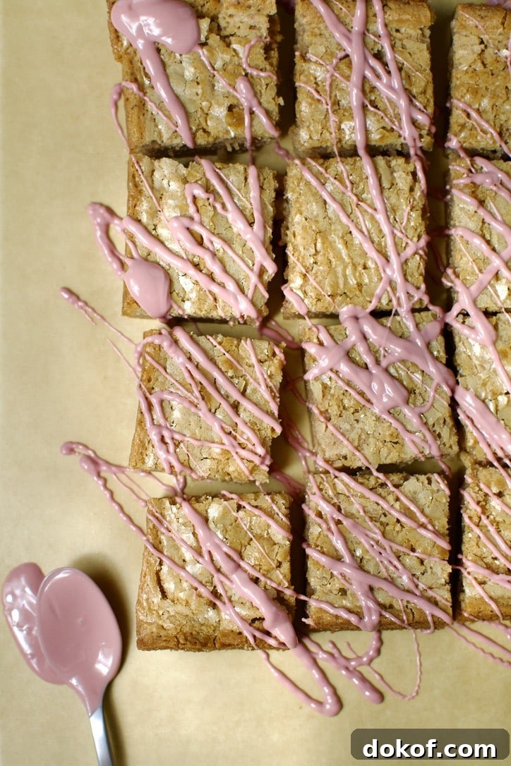 Ruby Chocolate Brownies, drizzled with melted ruby chocolate.