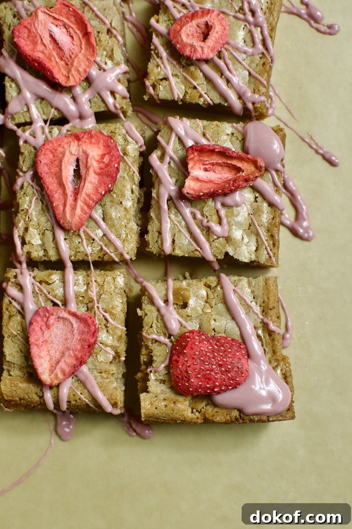 Ruby Chocolate Brownies ready to eat. Each square is topped with a freeze dried strawberry.