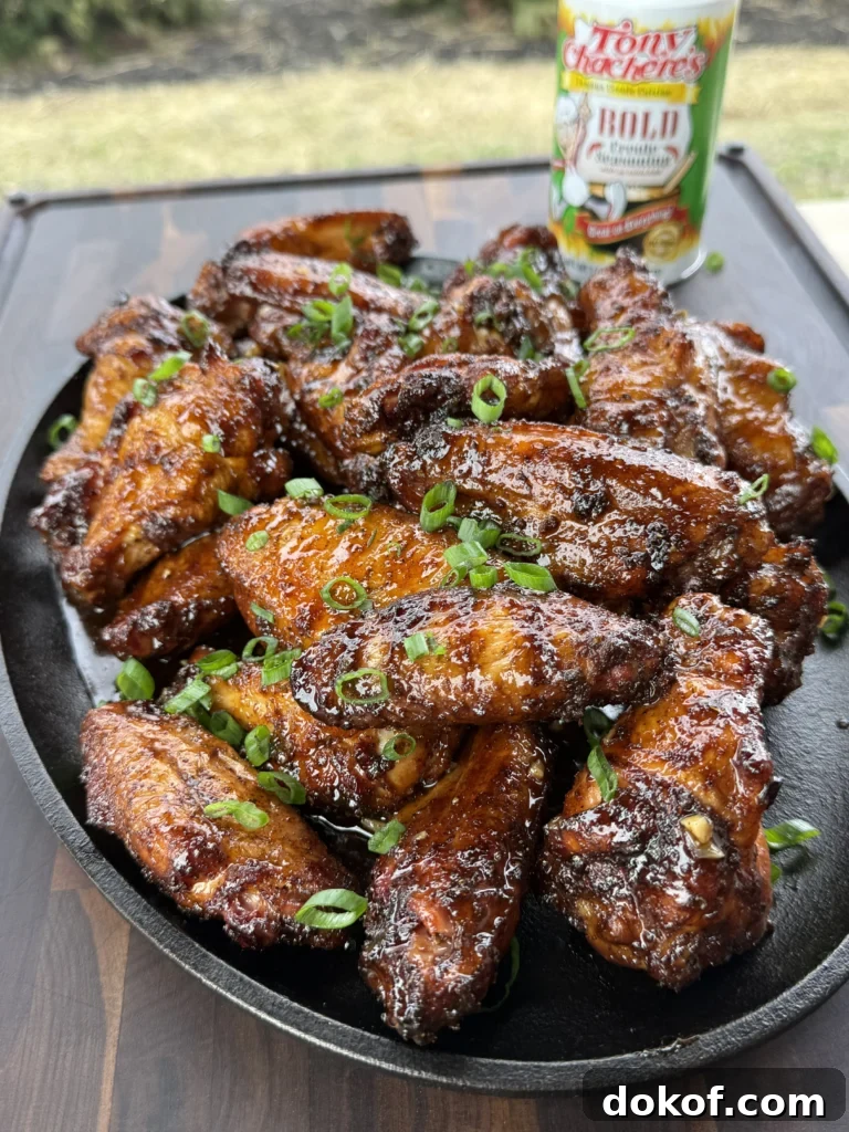 up close of the smoked chicken wings on a plate with Tony's seasoning