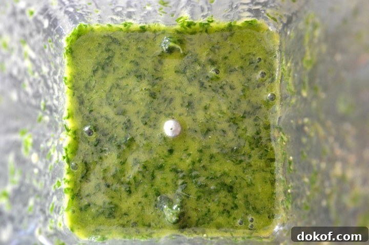 cilantro lime vinaigrette being blended in blender