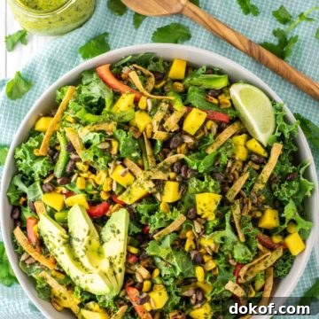 overhead shot of mango quinoa salad in bowl with cilantro lime vinaigrette