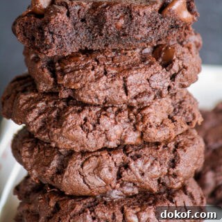 Rich, fudgy triple chocolate cookies with crisp edges and soft centers