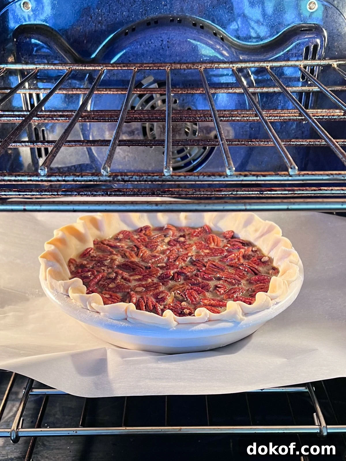 Pecan pie being put in the oven.