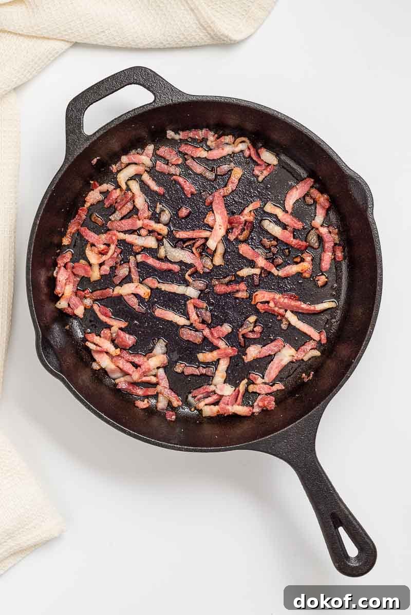 Cooking the bacon or pancetta.