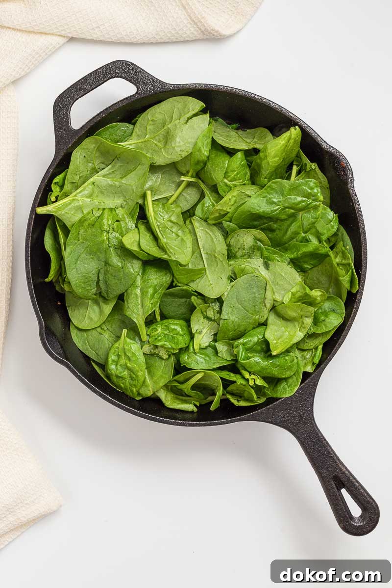 Cooking the spinach.