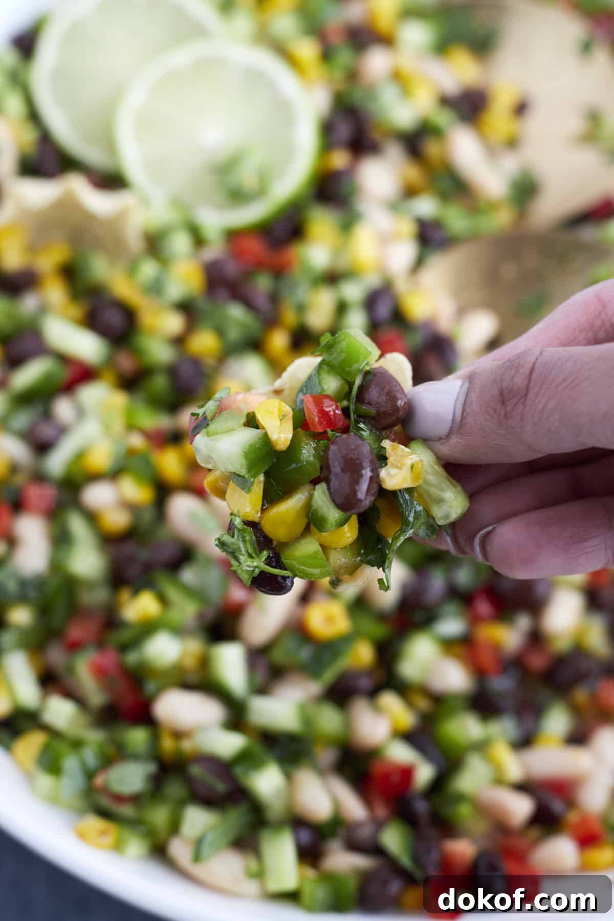 closeup scoop of cowboy caviar with tortilla scoops