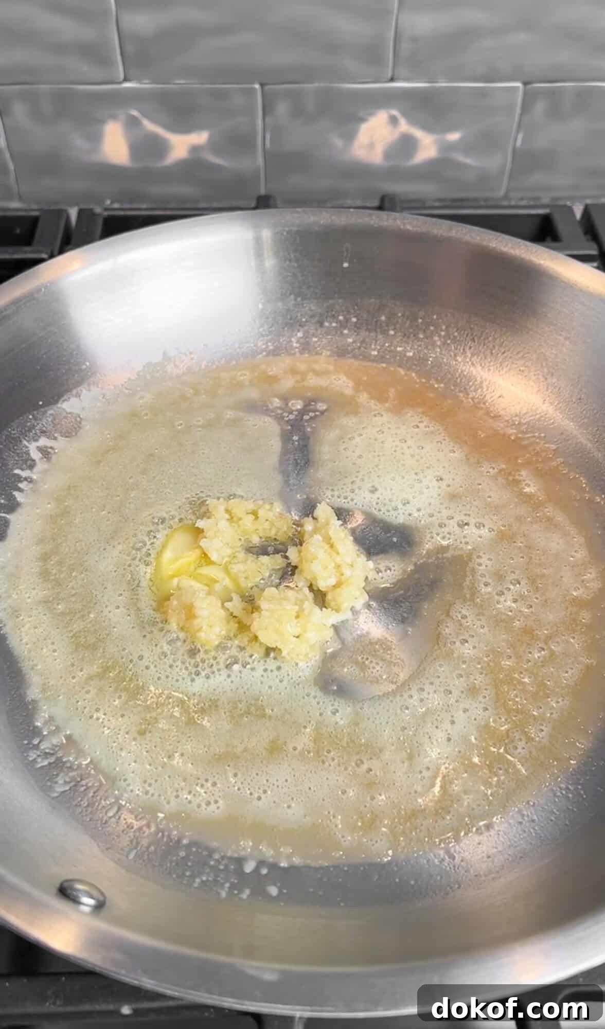 sautéing garlic in butter for creamy lemon pasta