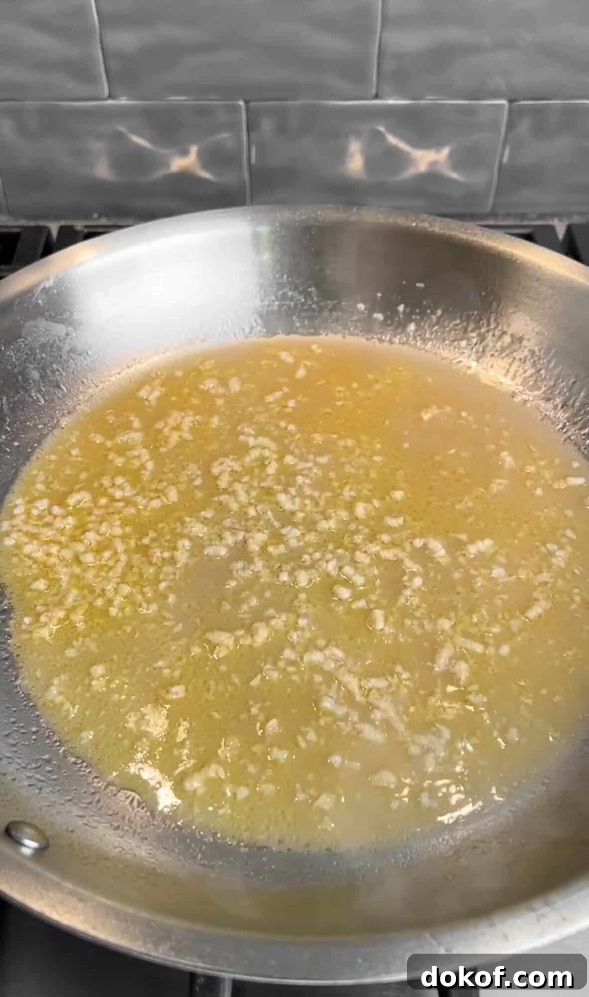 reducing the wine for creamy lemon pasta