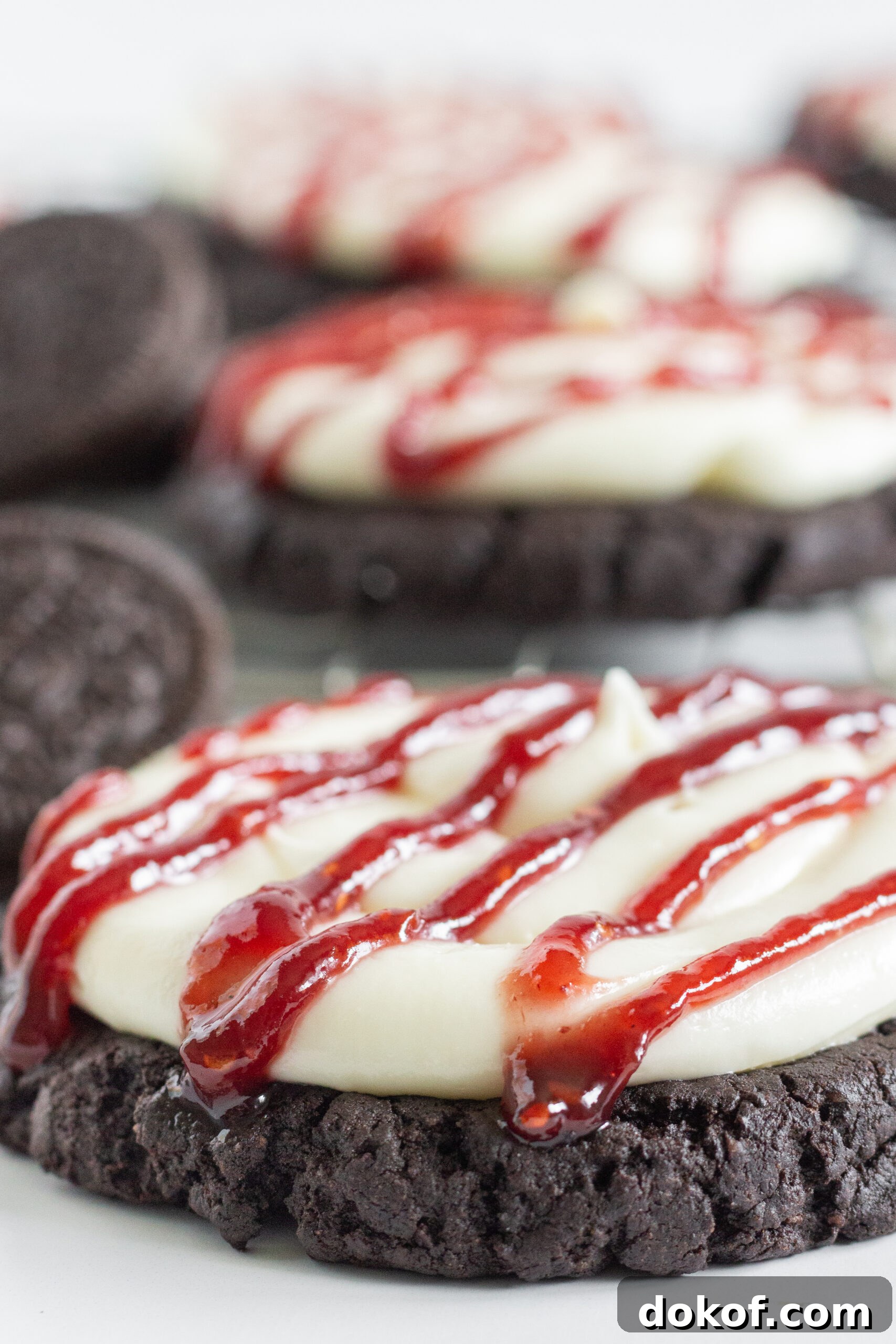 Chocolate Cake Mix Cookies: 12 Irresistible Recipes You’ll Love 19 Oreo Raspberry Cheesecake Cookies with raspberry drizzle.