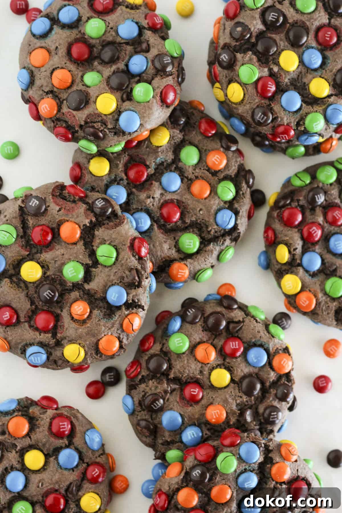 Chocolate Cake Mix Cookies: 12 Irresistible Recipes You’ll Love 10 Eight chocolate cake mix M&M cookies on a plate being served.