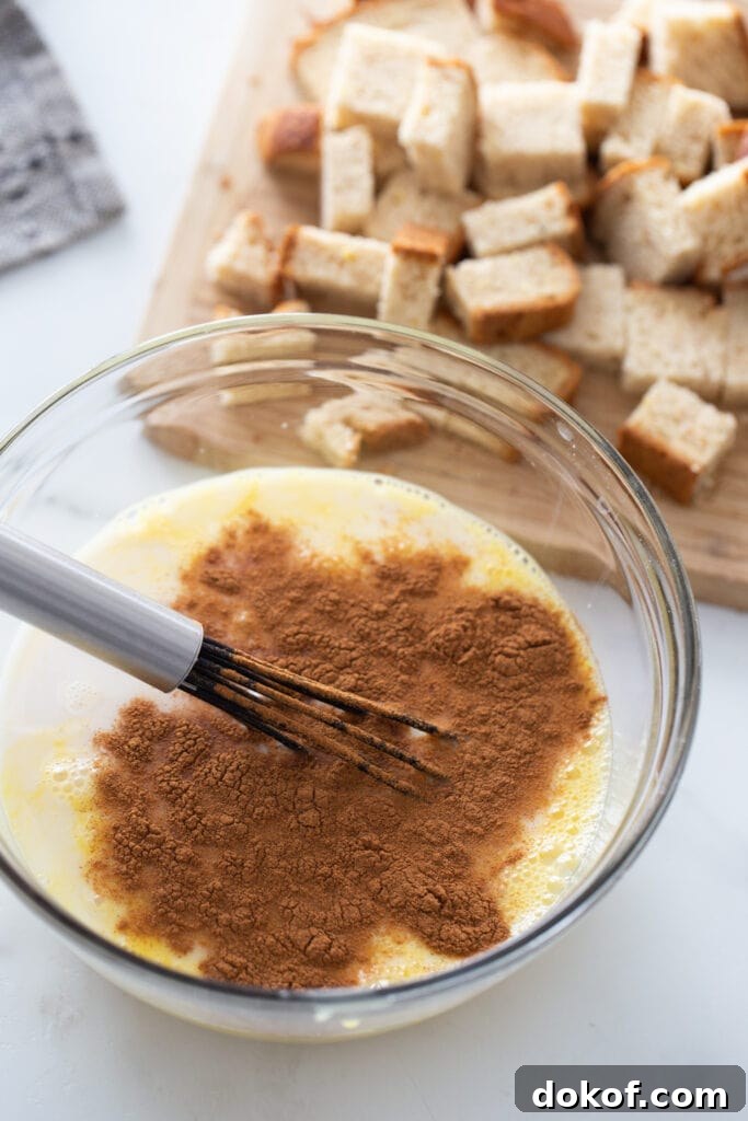 Cinnamon Roll French Toast Casserole Cups Recipe 5 The ingredients for French toast are on a white surface.