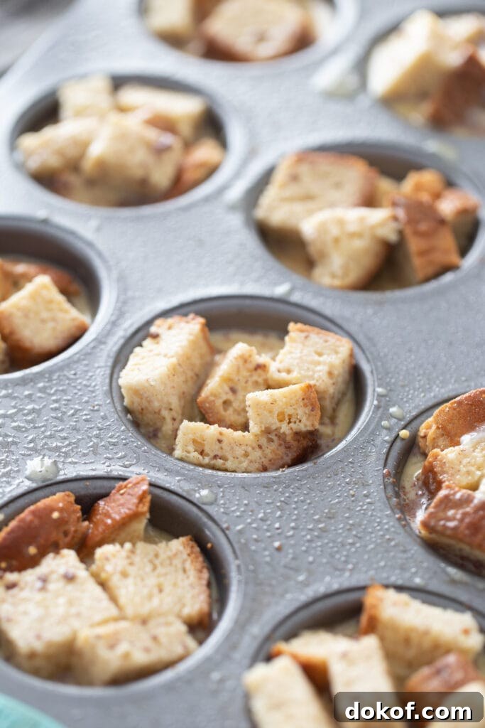 Cinnamon Roll French Toast Casserole Cups Recipe 6 Bread cubes are in cupcake tins.