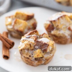 Three French toast cups are on a white plate.