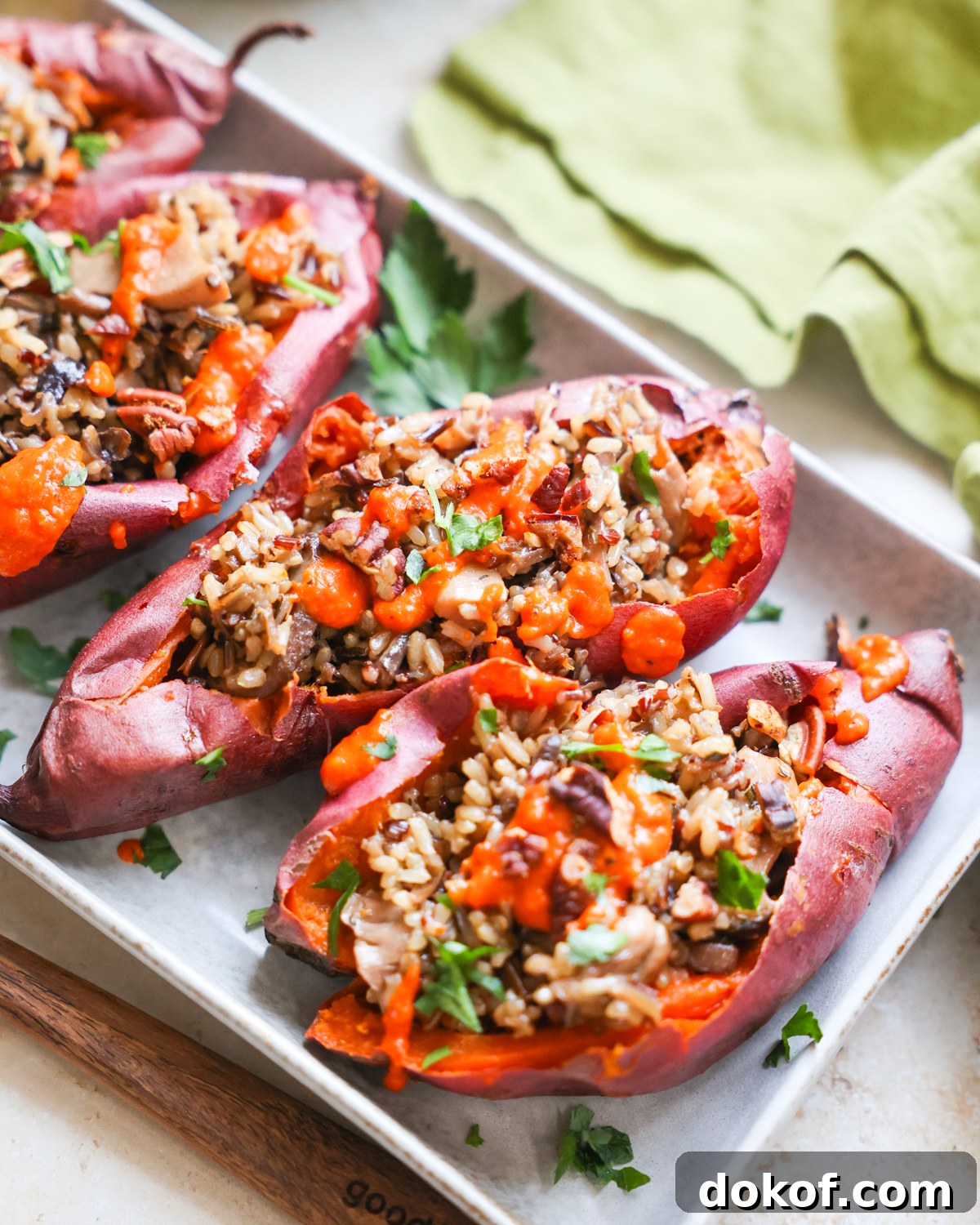 100 Must-Try Vegan Recipes for Every Meal 2 Stuffed sweet potatoes on platter.