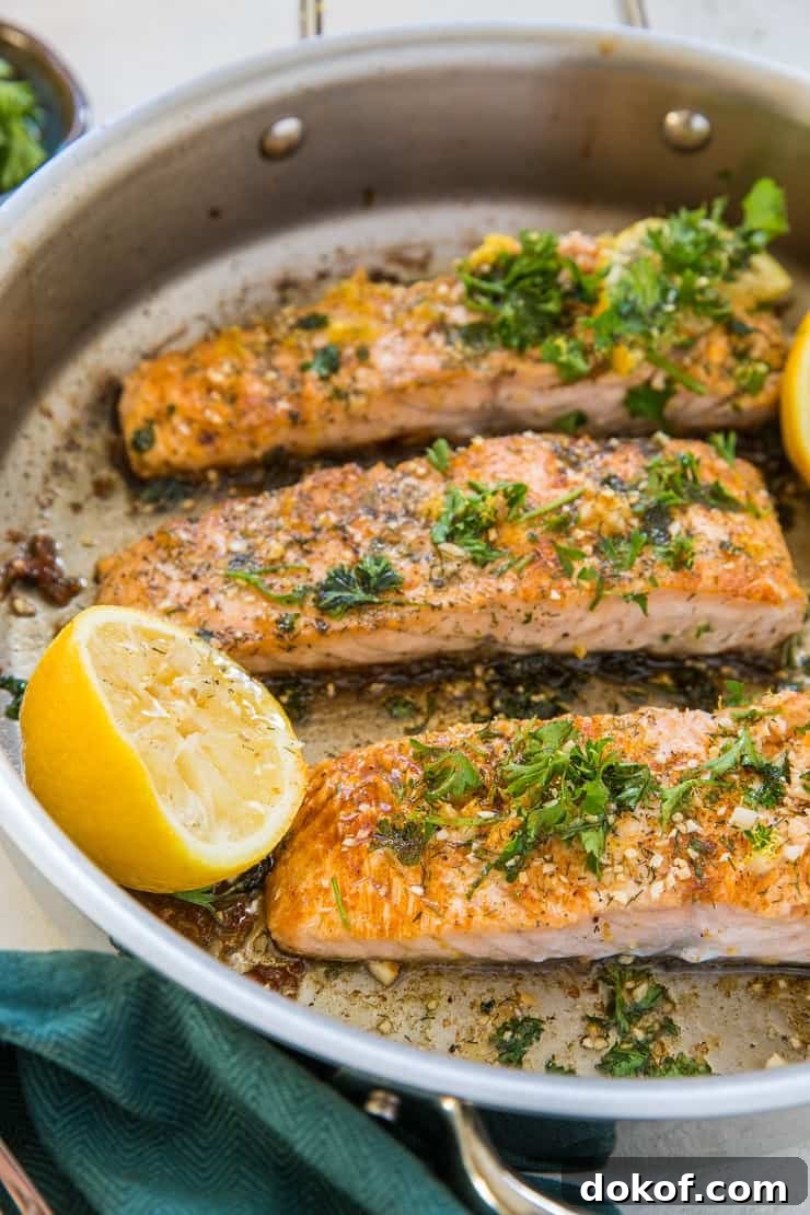 Two cooked salmon fillets with lemon