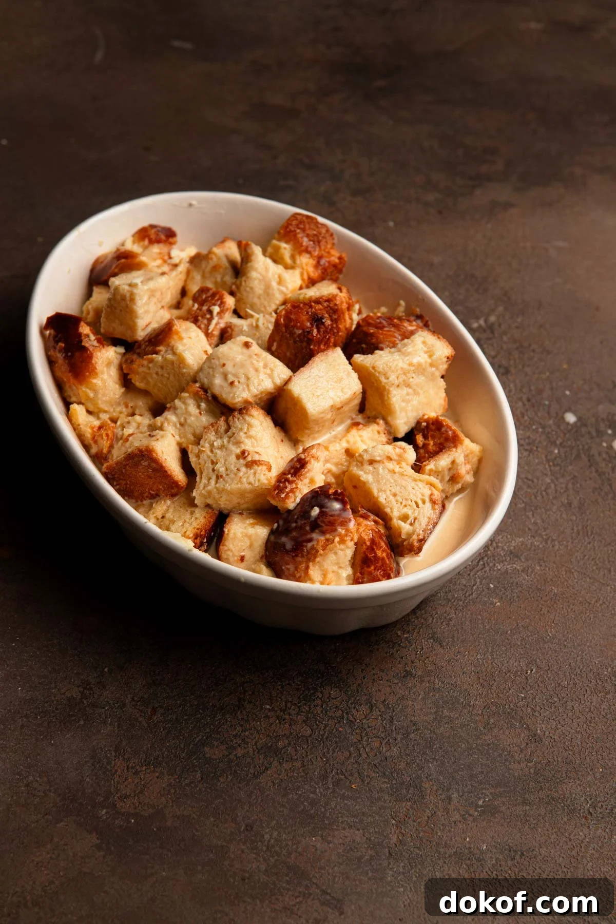 Unbaked brioche bread pudding.