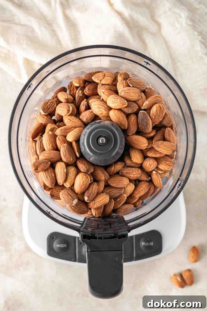 Homemade Almond Butter: Simple Recipe for Smooth, Creamy Spread 5 Roasted almonds in the food processor.