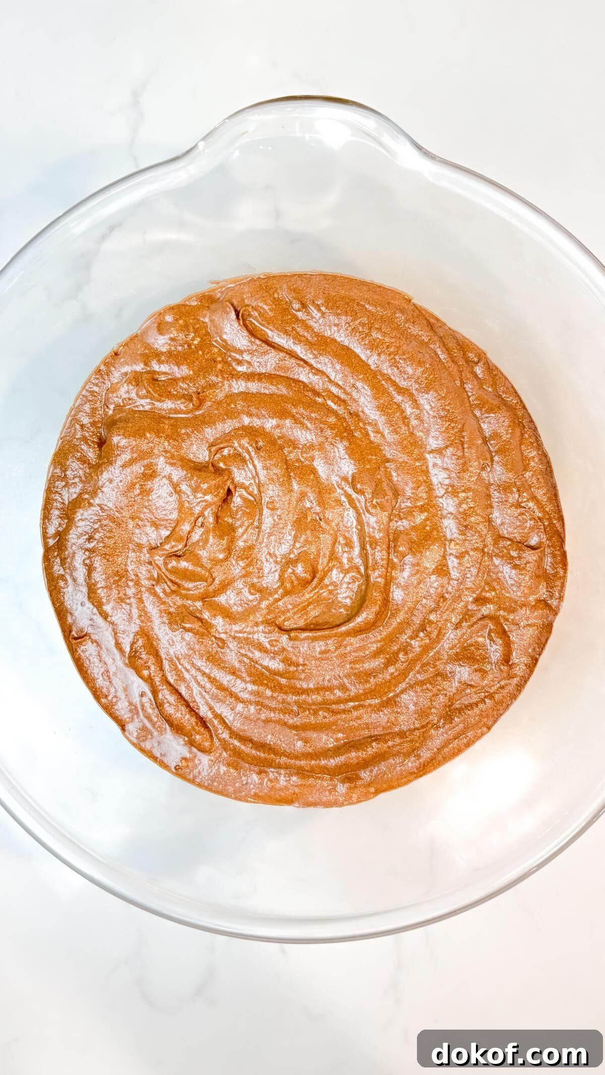 Mixed cake batter in a bowl.