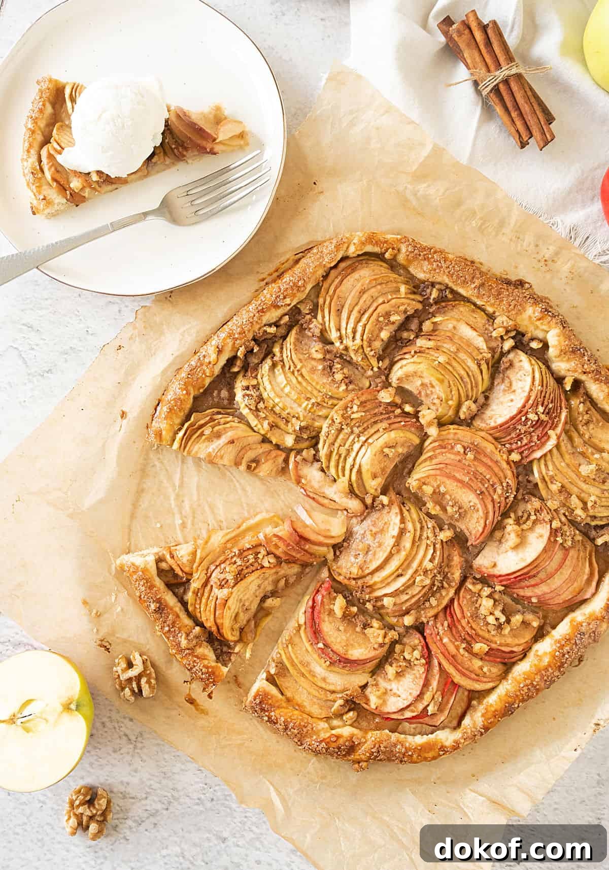 Rustic Apple Galette Recipe: Simple Homemade Apple Tart 2 Slice of apple galette on a white plate and whole tart on beige parchment paper.