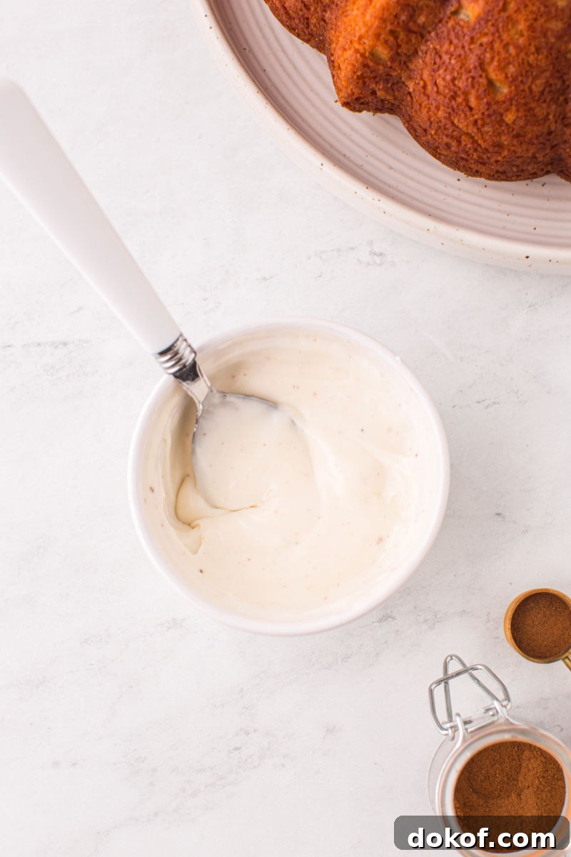 bowl of eggnog glaze with a spoon