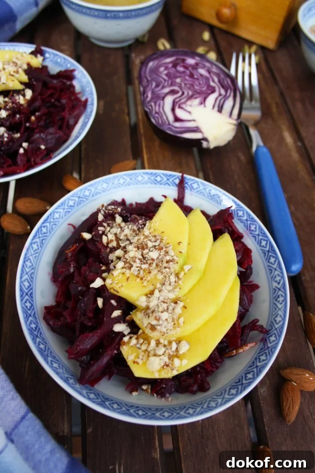 Delicious and healthy 5-minute recipe of a sauerkraut salad with mango, almonds and lemon-cardamom vinaigrette. Vegan, vegetarian, raw, gluten-free.