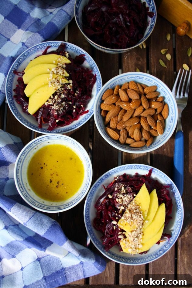 Sauerkraut Salad with Mango and Almonds — Refreshing Tangy Twist 4 Delicious and healthy 5-minute recipe of a sauerkraut salad with mango, almonds and lemon-cardamom vinaigrette. Vegan, vegetarian, raw, gluten-free.