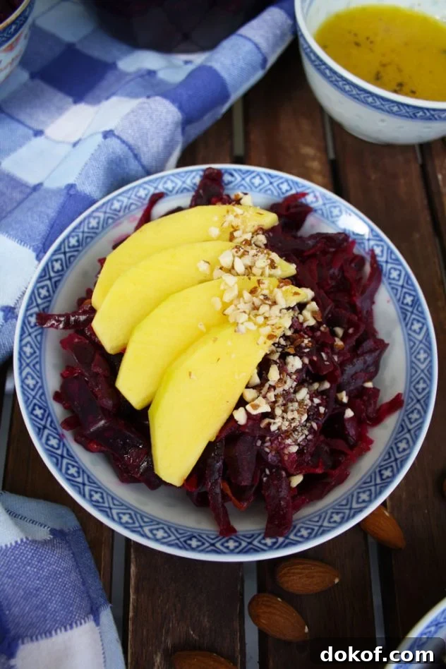 Sauerkraut Salad with Mango and Almonds — Refreshing Tangy Twist 5 Delicious and healthy 5-minute recipe of a sauerkraut salad with mango, almonds and lemon-cardamom vinaigrette. Vegan, vegetarian, raw, gluten-free.