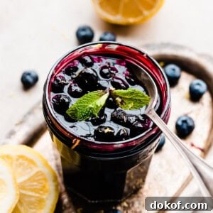 A jar of blueberry sauce.