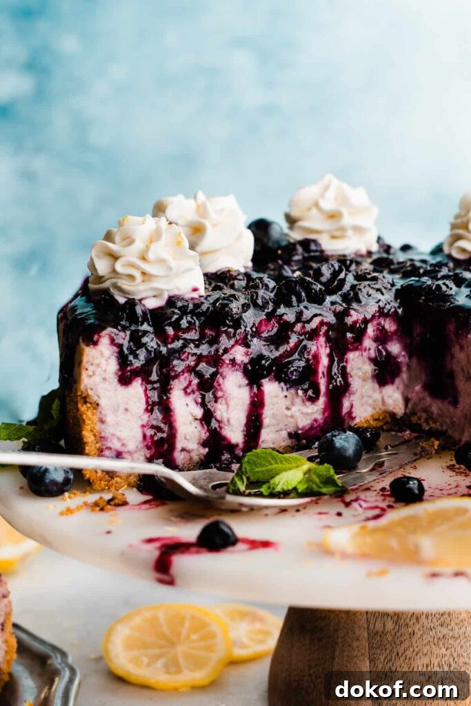 Blueberry cheesecake topped with blueberry sauce.