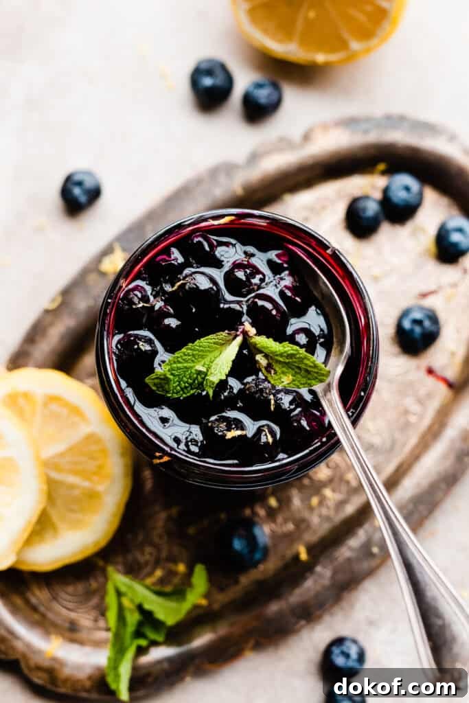 A jar of blueberry sauce.