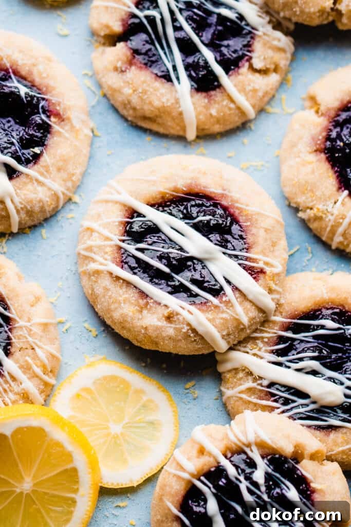 Blueberry sauce filled lemon thumbprint cookies.