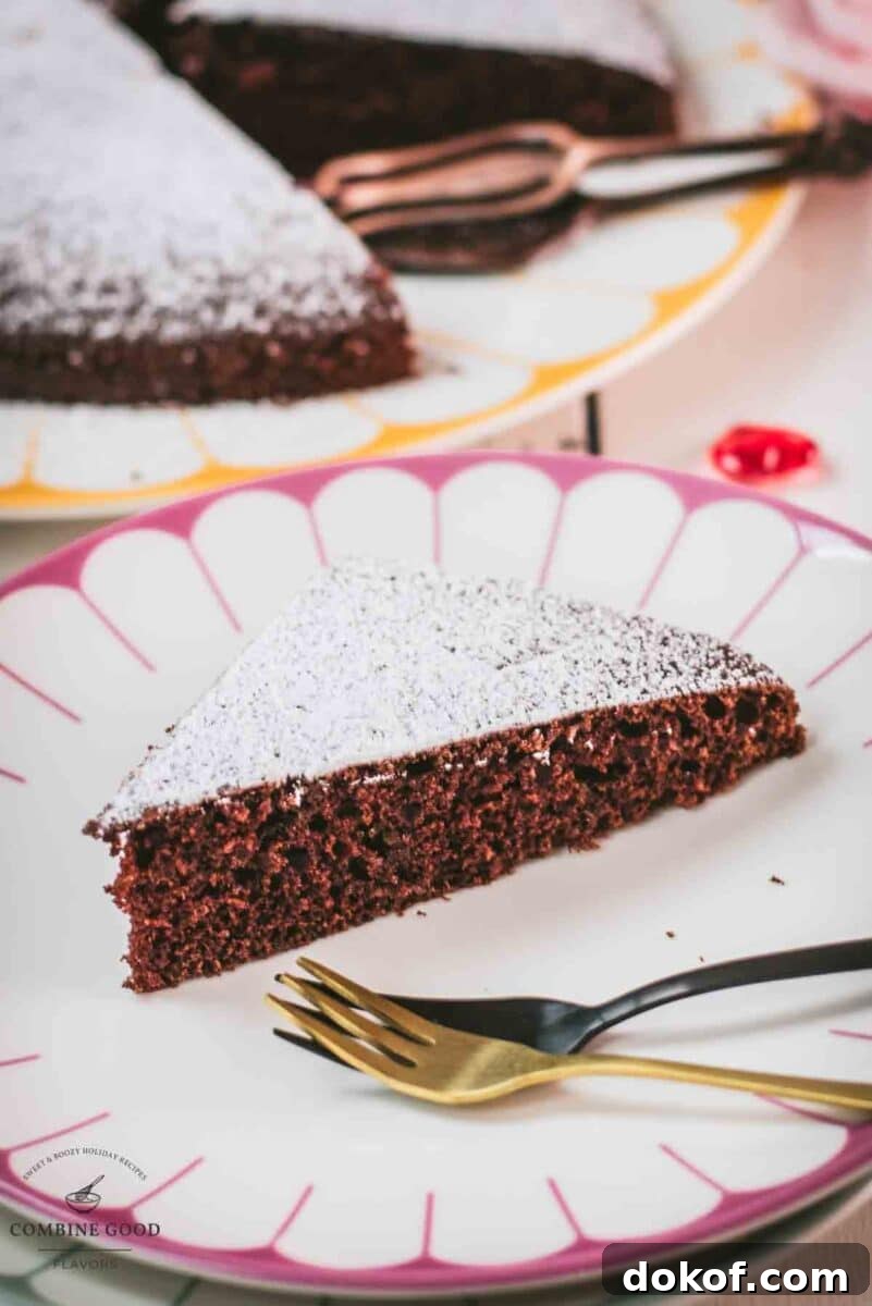 Delicious Valentine's chocolate cake slice, dusted with powdered sugar. Ideal for Valentine's day!
