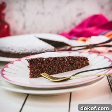 Delicious Valentine's chocolate cake slice, dusted with powdered sugar. Ideal for Valentine's day!
