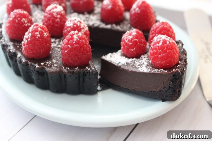 A slice of Raspberry chocolate tart