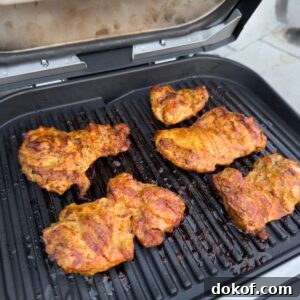 Lemon garlic chicken being grilled.