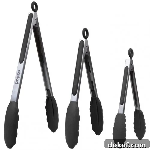 Three stainless steel kitchen tongs with black silicone grips and scalloped edges.