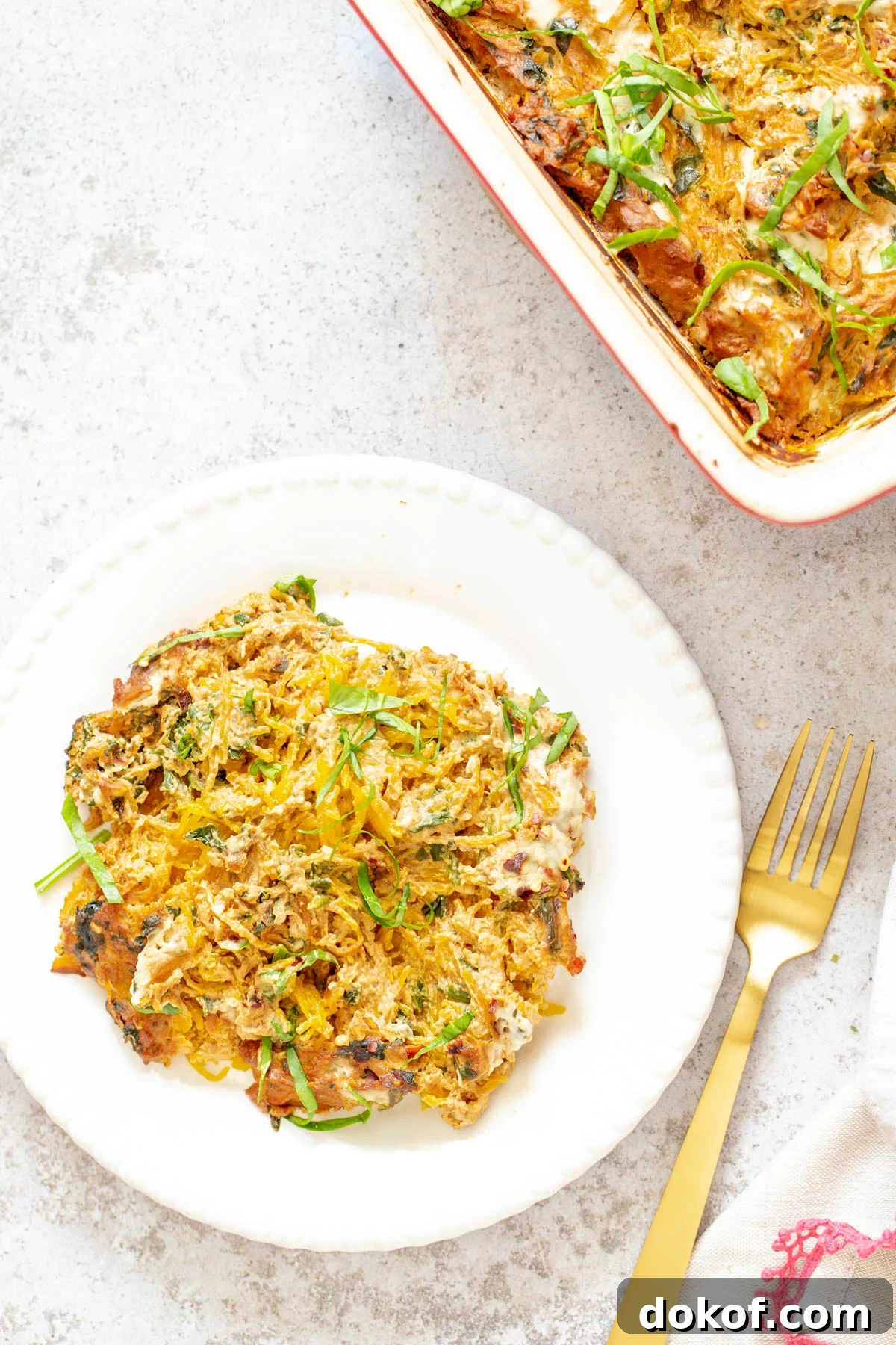 a plate with vegan spaghetti squash bake with creamy tomato sauce 