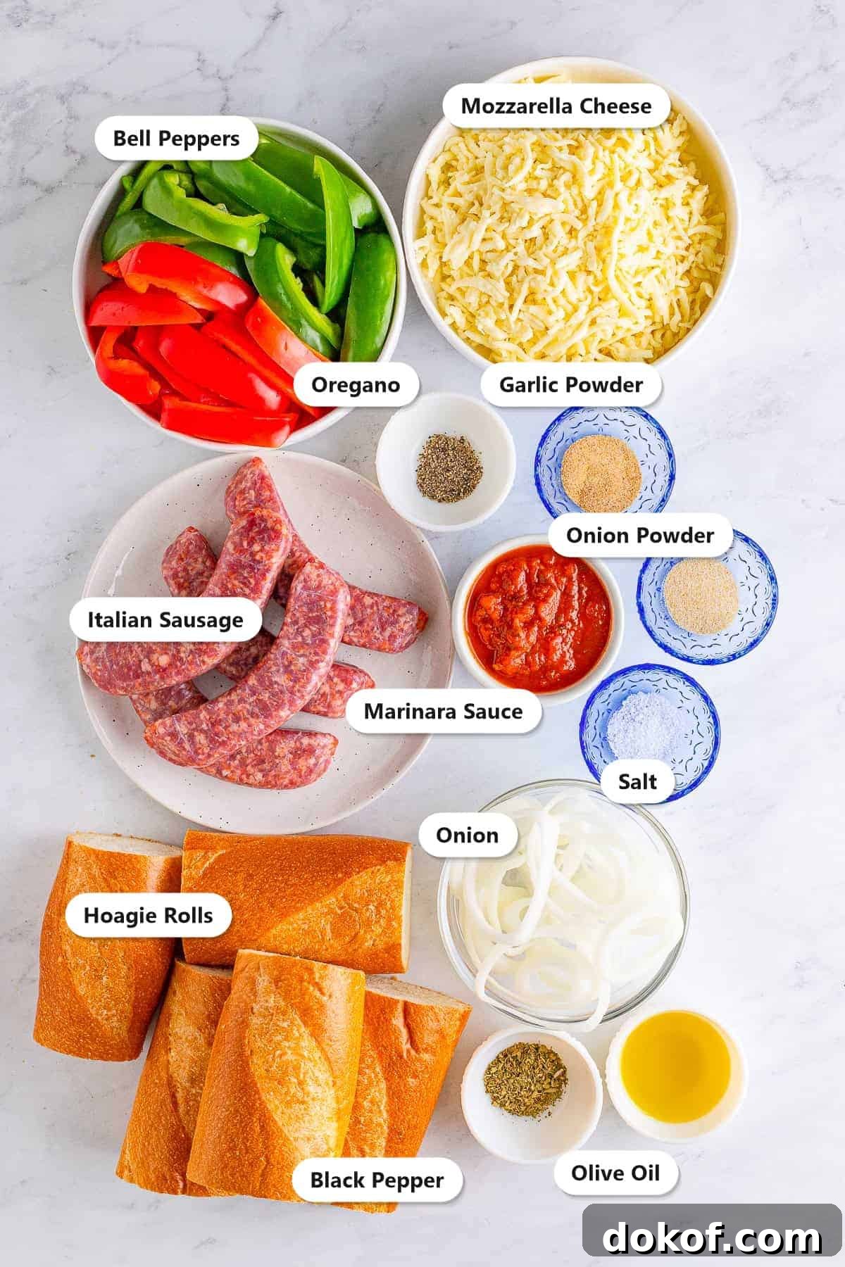 Labeled ingredients for Italian sausage sandwiches including bell peppers, onion, Italian sausage, marinara, mozzarella, hoagie rolls, and seasonings.