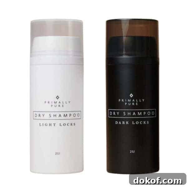 Two bottles of Primally Pure dry shampoo. 