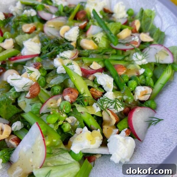 close up of asparagus salad on white plate