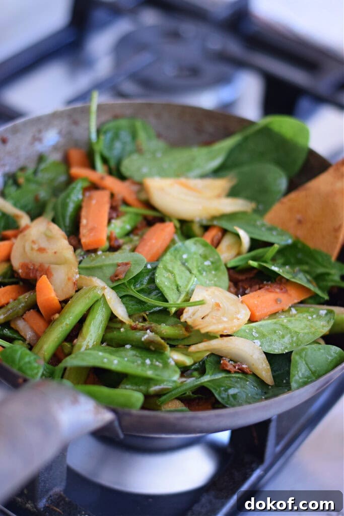 Vegetable stir fry in a wok.
