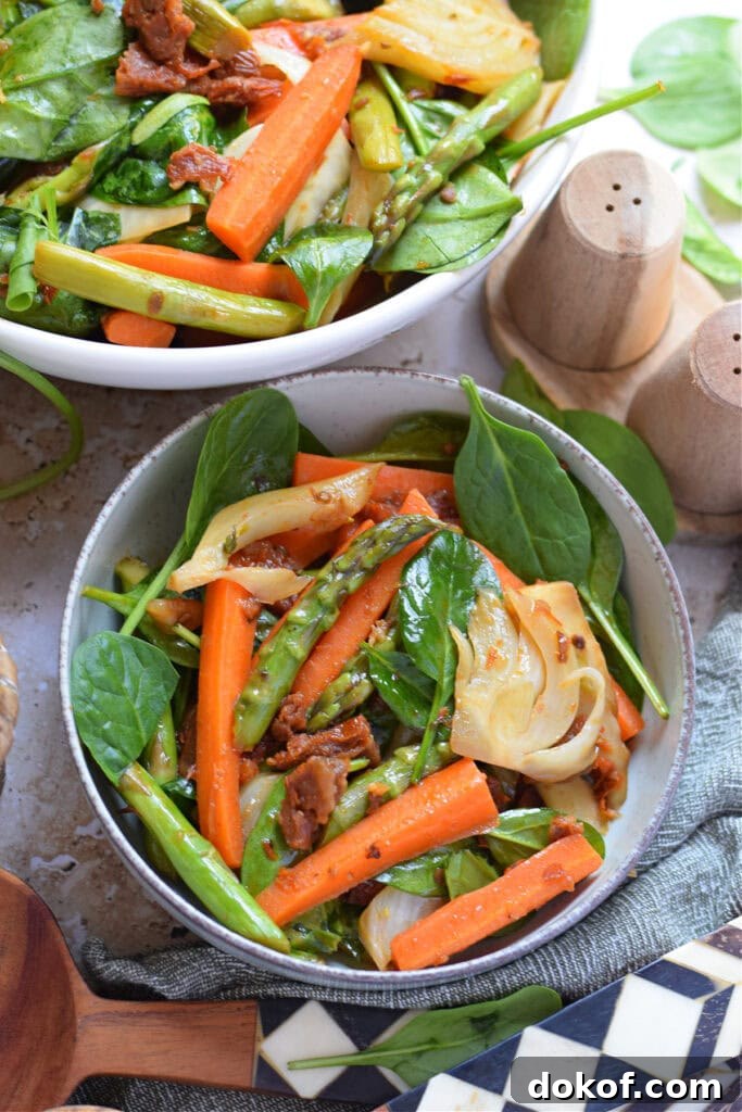 Spring vegetable stir fry in a serving bowl.