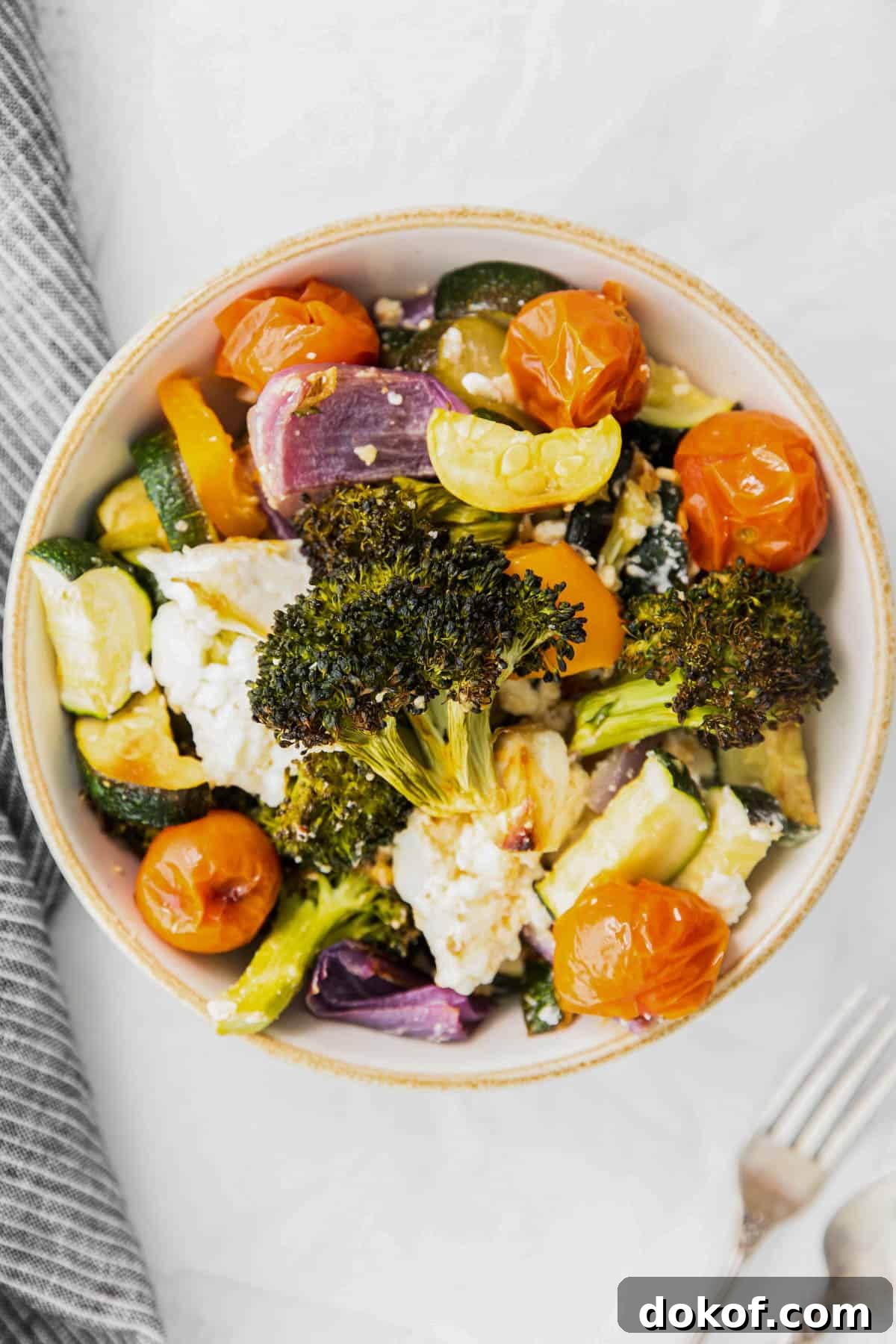roasted vegetables with feta in a bowl
