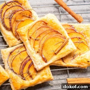 Flaky Peach Puff Pastry Tart Recipe for Summer Dessert 12 An overhead image of peach puff pastry on a wire rack.