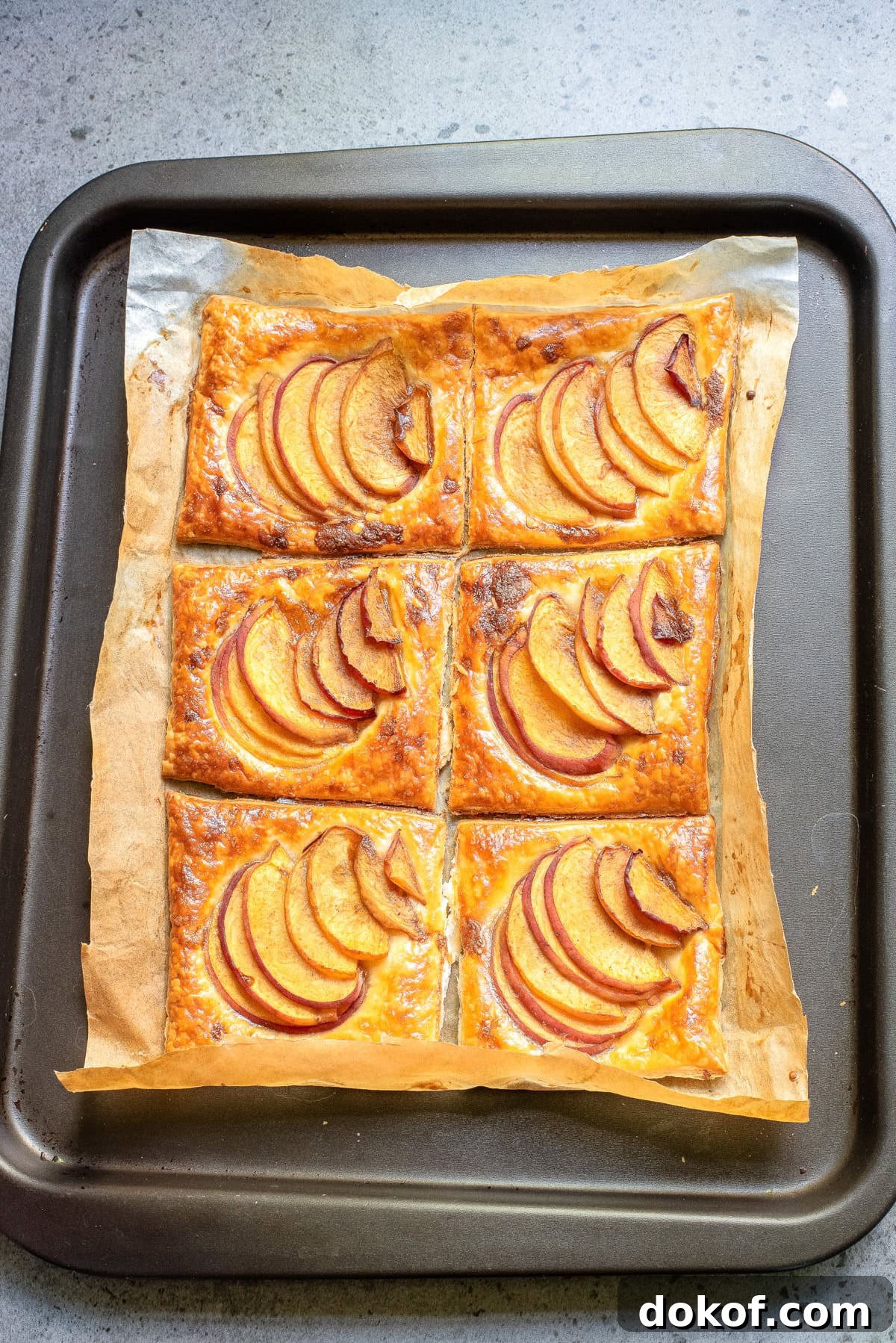 Flaky Peach Puff Pastry Tart Recipe for Summer Dessert 9 An overhead image of baked peach puff pastry.