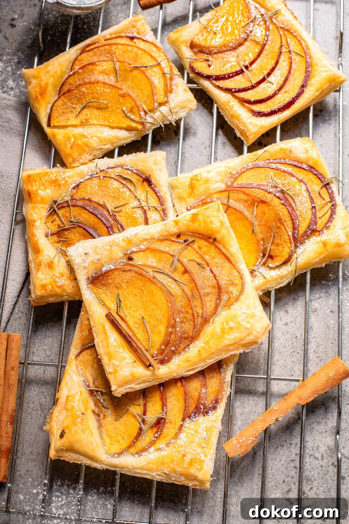 Flaky Peach Puff Pastry Tart Recipe for Summer Dessert 10 An overhead image of peach puff pastry on a wire rack.