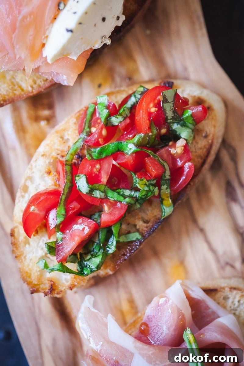 crostini topped with tomato and basil