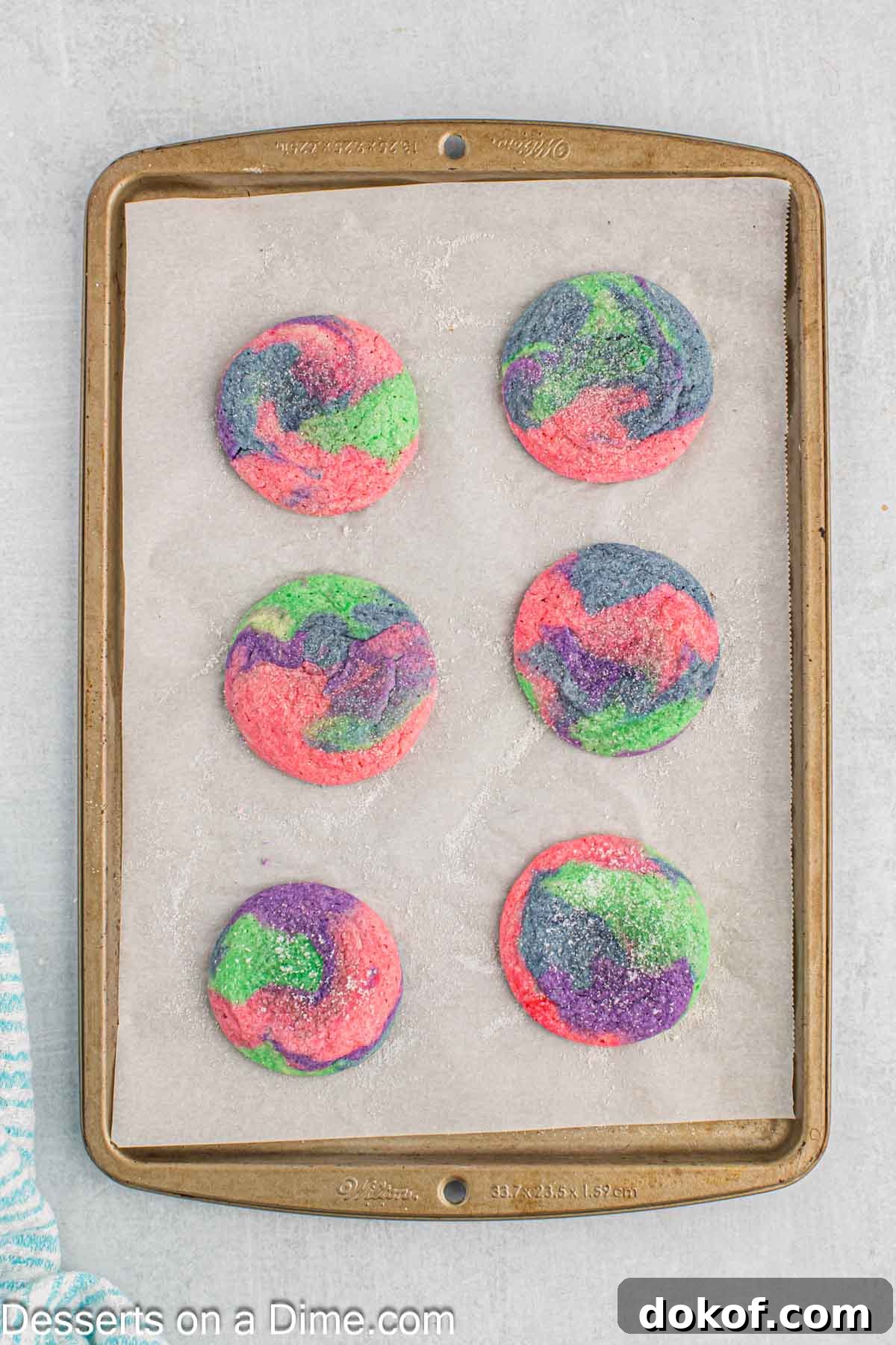 Cookies baked and resting on baking sheet.